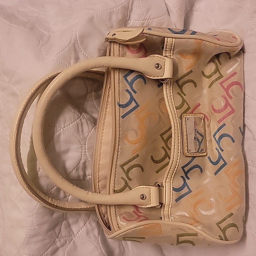 Liz Claiborne hand bag. Used, some call outs but nice starter purse. Multicolor